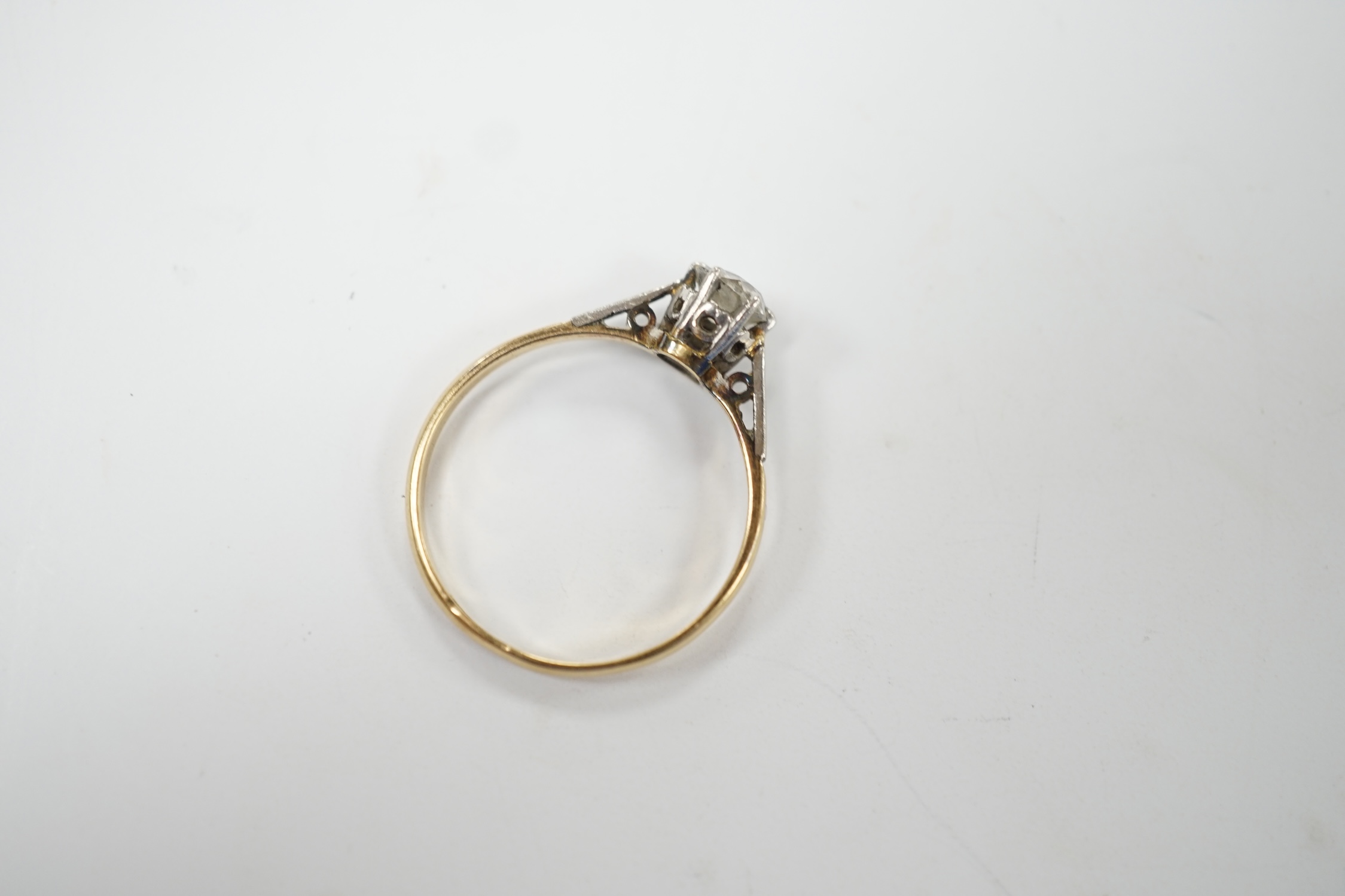 An 18ct, plat. and solitaire diamond set ring, size O, gross weight 1.7 grams. Fair condition.